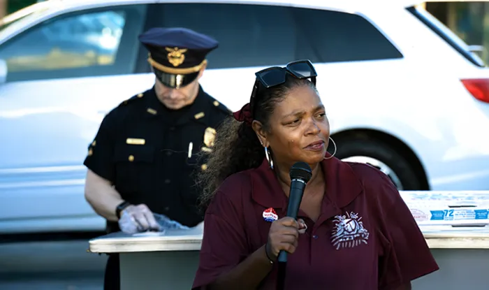 Woman speaking at outdoor community event